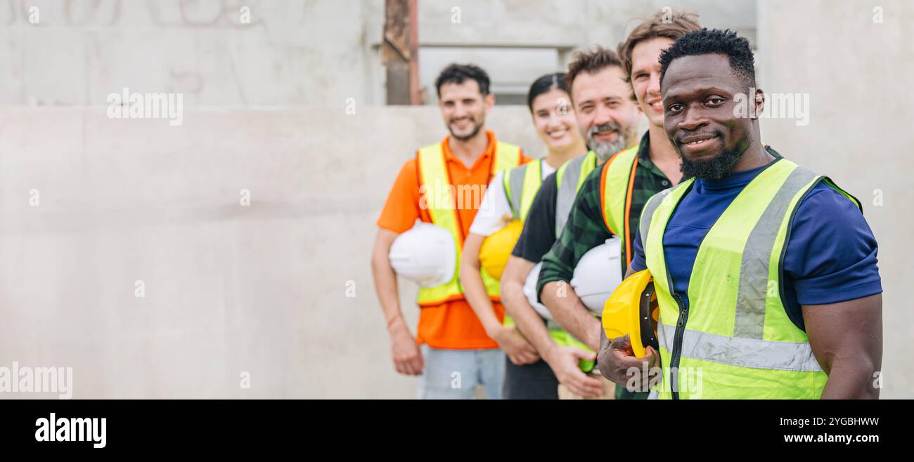 Workers teamwork in construction industrial plant. Diverse workers ...