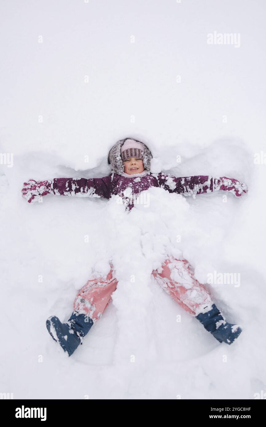 little-girl-covered-in-snow-laughing-and-playing-a-perfect-scene-of