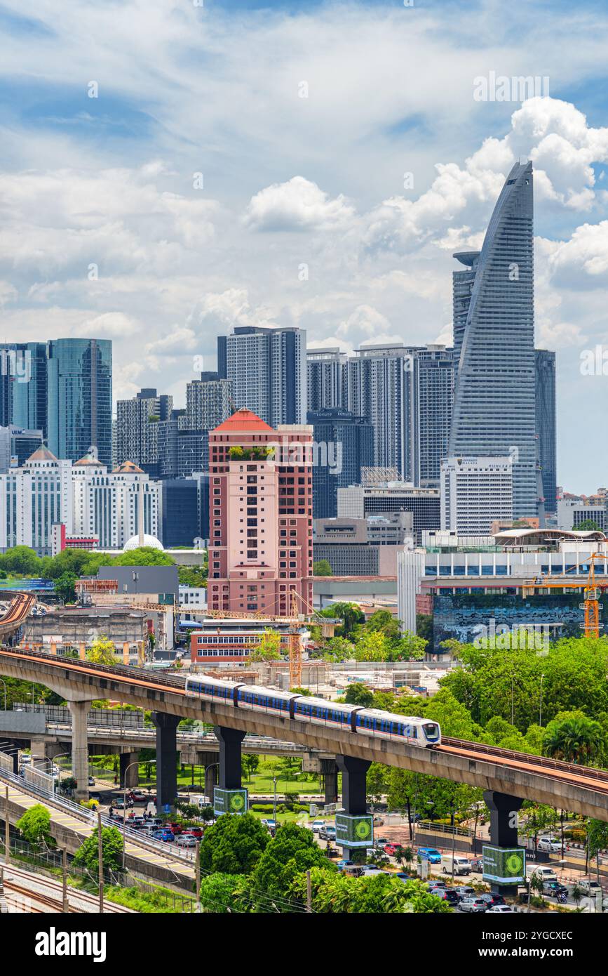 Train of the LRT Kelana Jaya Line. Kuala Lumpur skyline Stock Photo