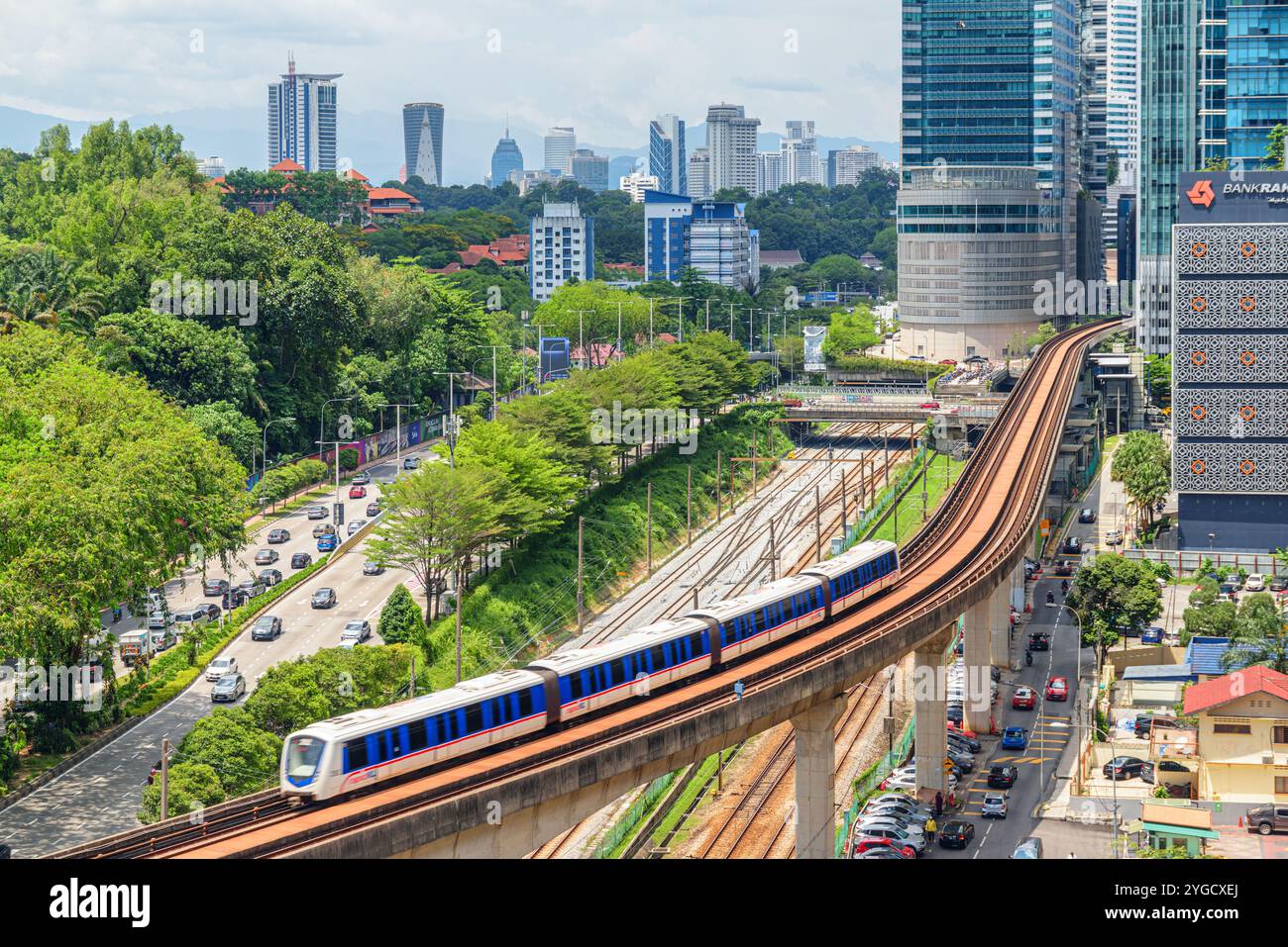 Train of the LRT Kelana Jaya Line. Kuala Lumpur skyline Stock Photo