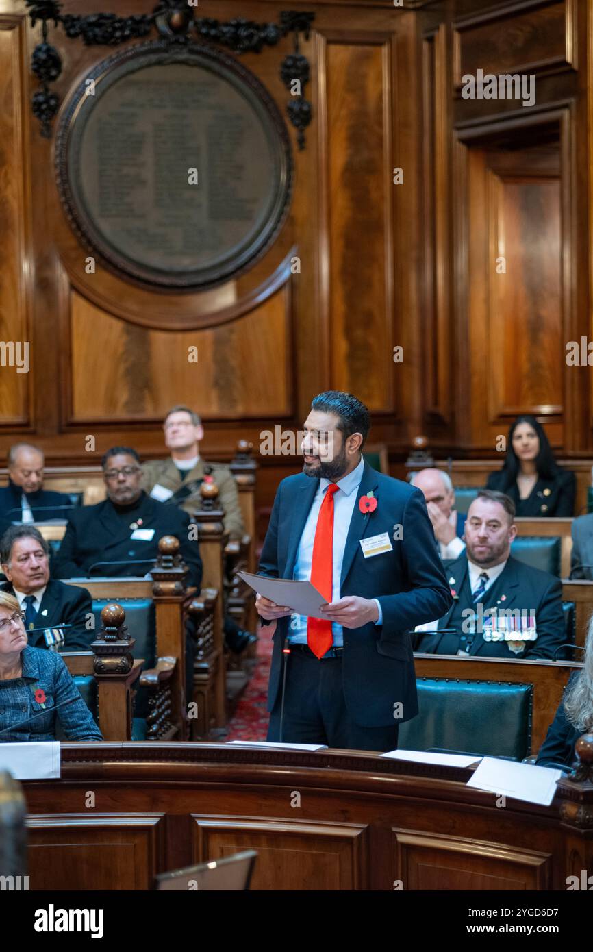 Councillor Kamran Hussain, Neighbourhoods and Community Safety Portfolio Holder, speaks to Community Leaders at Bradford Council chambers as Bradford Unveils First Commonwealth War Memorial Outside London. 6 November Bradford Cenotaph. Stock Photo