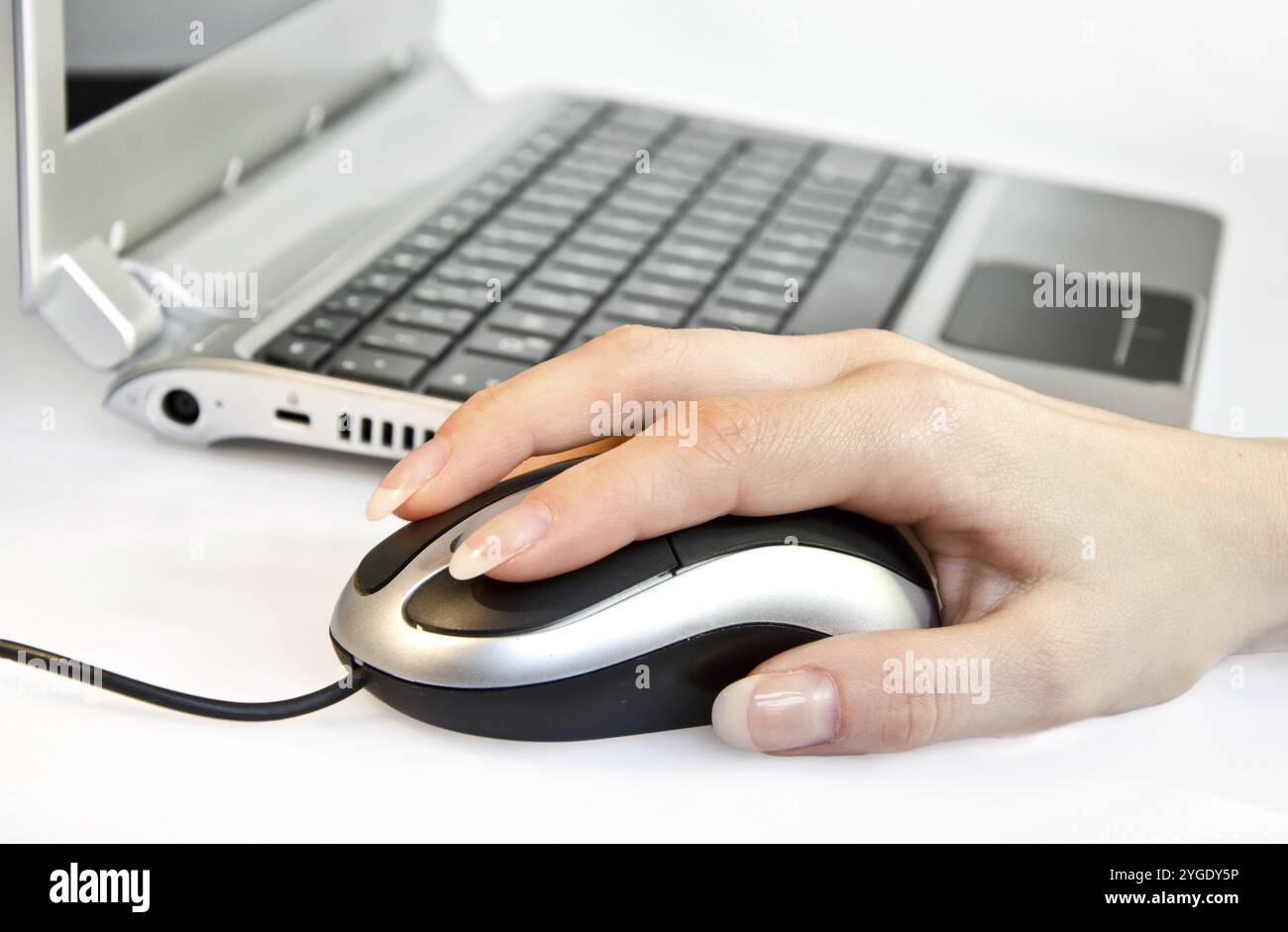 Female hand using computer mouse Stock Photo - Alamy