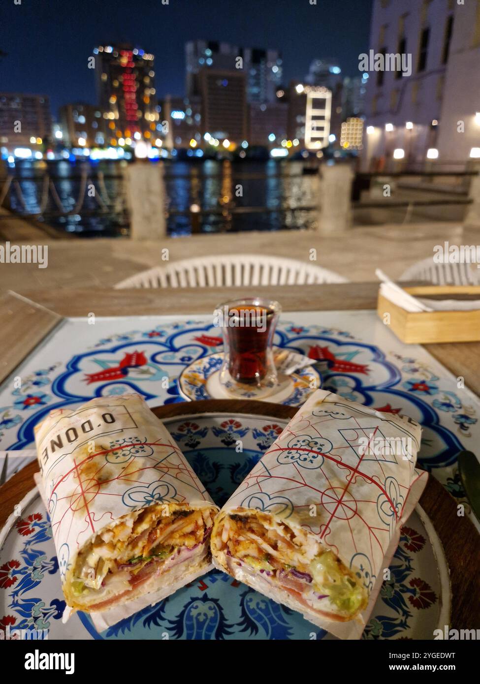 The image captures a scenic dining experience in Deira Old City, Dubai ...