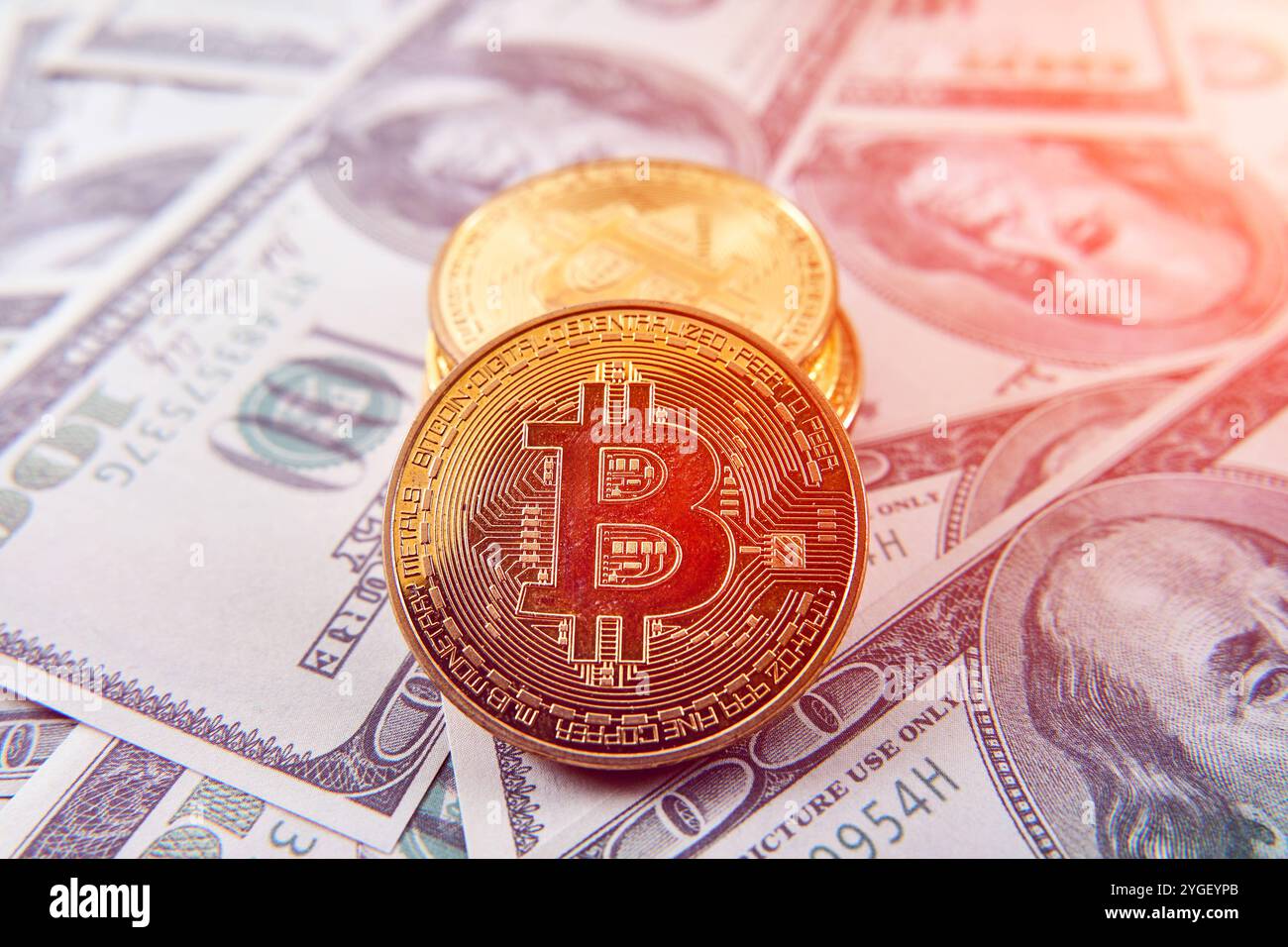 Bitcoin gold coins on US dollar bills. The concept of a peer-to-peer  payment system that uses the same unit for accounting transactions Stock  Photo - Alamy