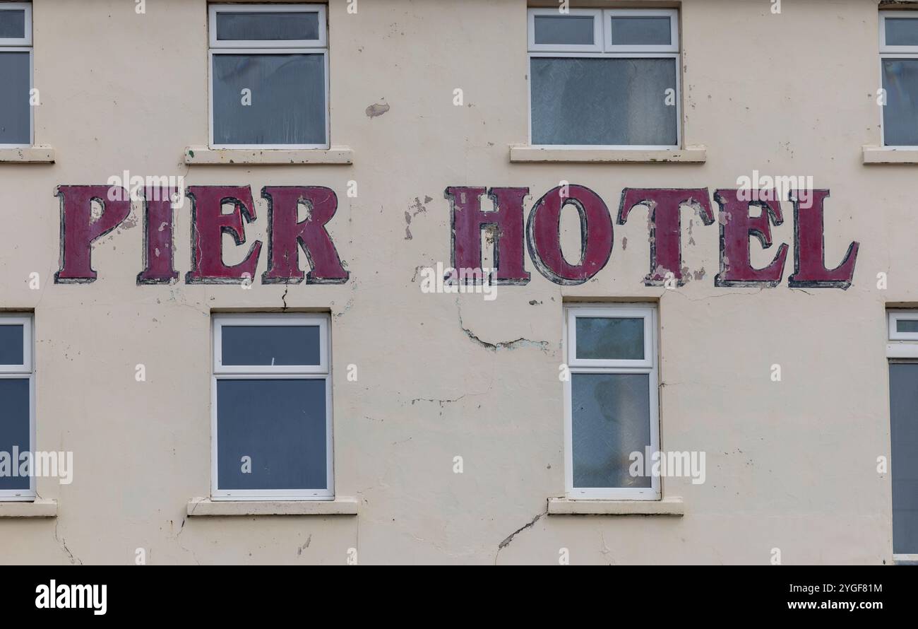 Lettering on the side of the disused Pier Hotel, Porthcawl, South Wales ...