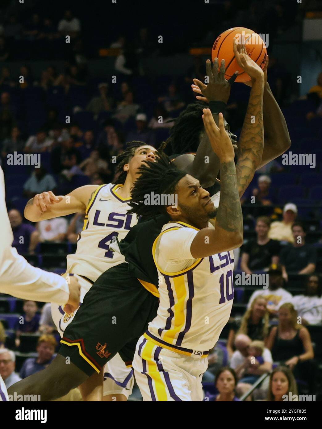 Baton Rouge, United States. 06th Nov, 2024. Both Louisiana Monroe Warhawks forward AD Diedhiou (34) and LSU Tigers forward Daimion Collins (10) fight for the ball during a men's basketball game at the Pete Maravich Assembly Center on Wednesday, November 6, 2024 in Baton Rouge, Louisiana. (Photo by Peter G. Forest/SipaUSA) Credit: Sipa USA/Alamy Live News Stock Photo