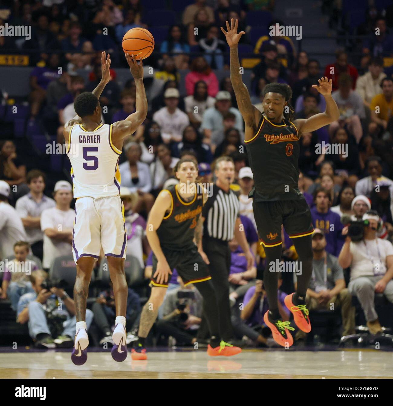 Baton Rouge, United States. 06th Nov, 2024. LSU Tigers guard Cam Carter (5) shoots a three-pointer over Louisiana Monroe Warhawks guard Jacob Wilson (0) during a men's basketball game at the Pete Maravich Assembly Center on Wednesday, November 6, 2024 in Baton Rouge, Louisiana. (Photo by Peter G. Forest/SipaUSA) Credit: Sipa USA/Alamy Live News Stock Photo