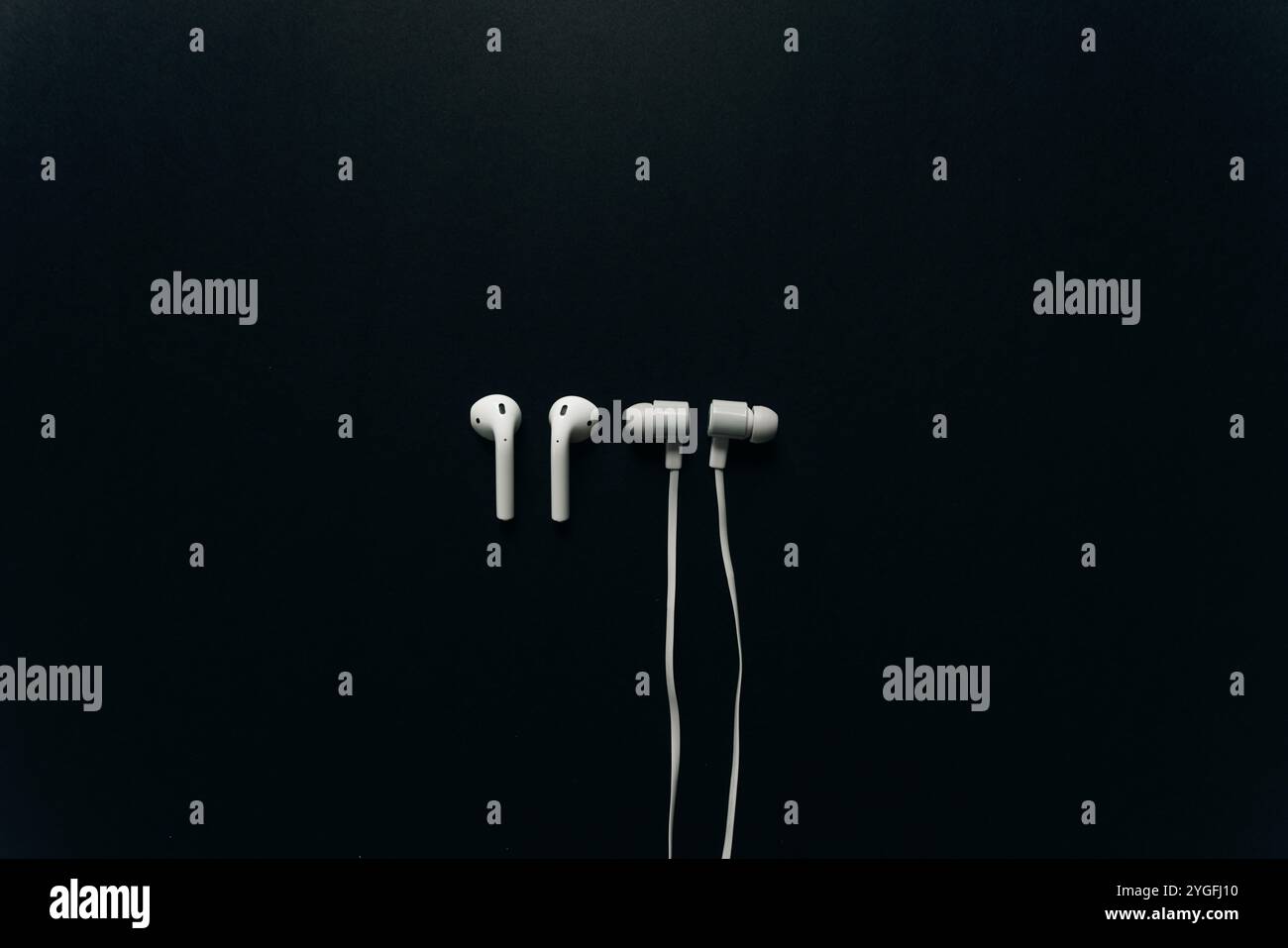 wired and wireless headphones on black background. High quality photo ...