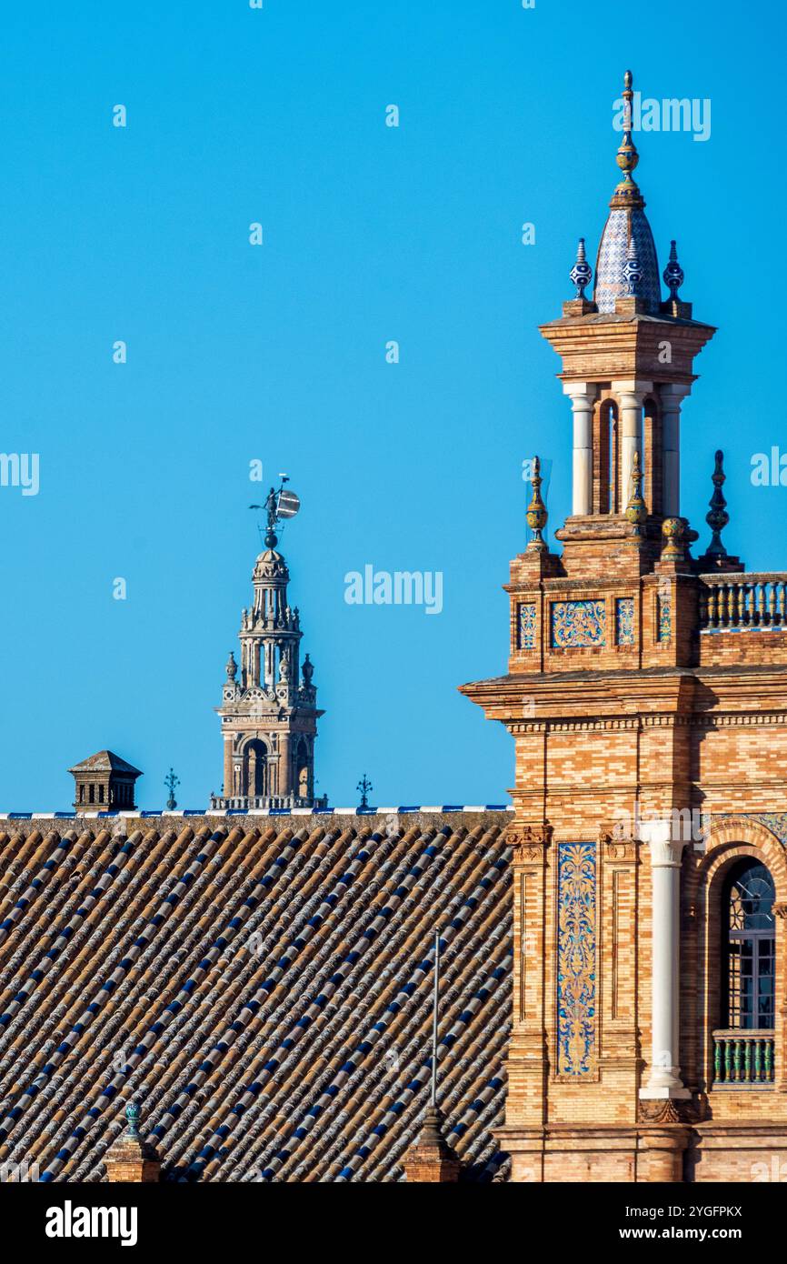 A stunning portrayal of the architectural grandeur of Plaza de España in Seville, Spain, featuring intricate brickwork and the historic Giralda tower Stock Photo