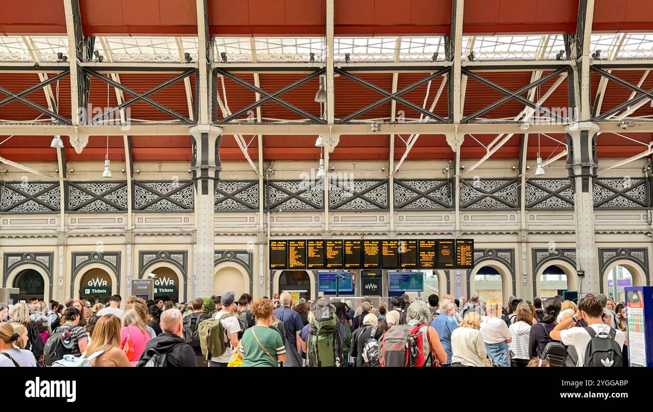 London, England, UK - 24 August 2023: Crowd of passengers waiting in front of a departures board for trains at Paddington railway station in central L - Smartphone Captured Stock Image