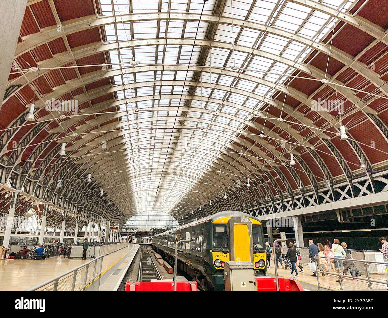 London, England, UK - 24 August 2023: Wide angle view of  Paddington railway station in central London with a commuter train at the platform. - Smartphone Captured Stock Image