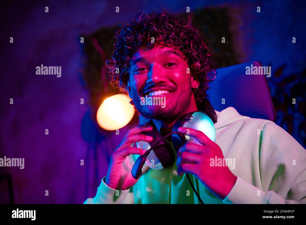 Photo of cute young guy cheerful toothy smile play gamer computer ...