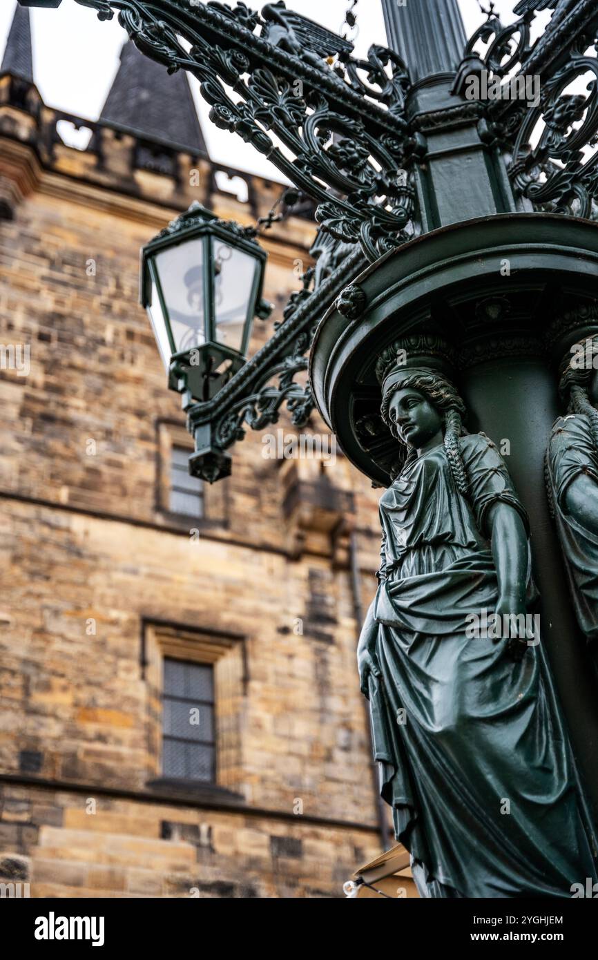 Lamppost in the shape of a female figure made of dark green cast iron, in the Mala Strana (Lesser Town) district, Prague, Czechia Stock Photo