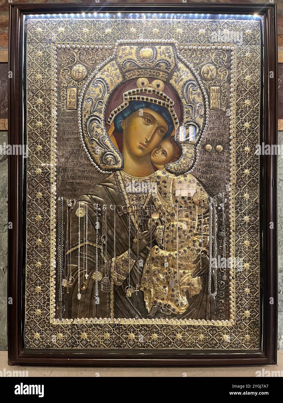 Gilded Orthodox metal icon with gold accents in the St. Alexander Nevsky Patriarchal Cathedral in Sofia Bulgaria, Eastern Europe, Balkans, EU - Smartphone Captured Stock Image