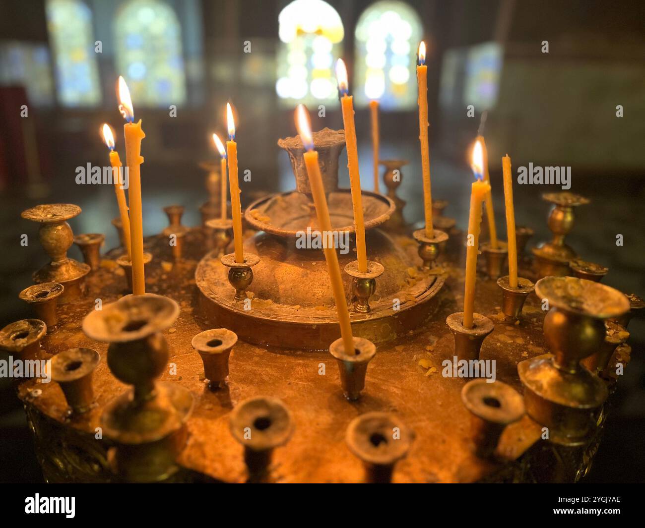 Burning church candles in St. Alexander Nevsky Patriarchal Orthodox Cathedral interior in Sofia Bulgaria, Eastern Europe, Balkans, EU - Smartphone Captured Stock Image