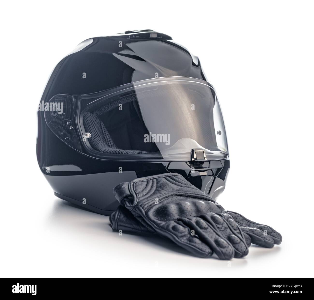 Black motorcycle helmet and leather gloves isolated on a white background. Stock Photo