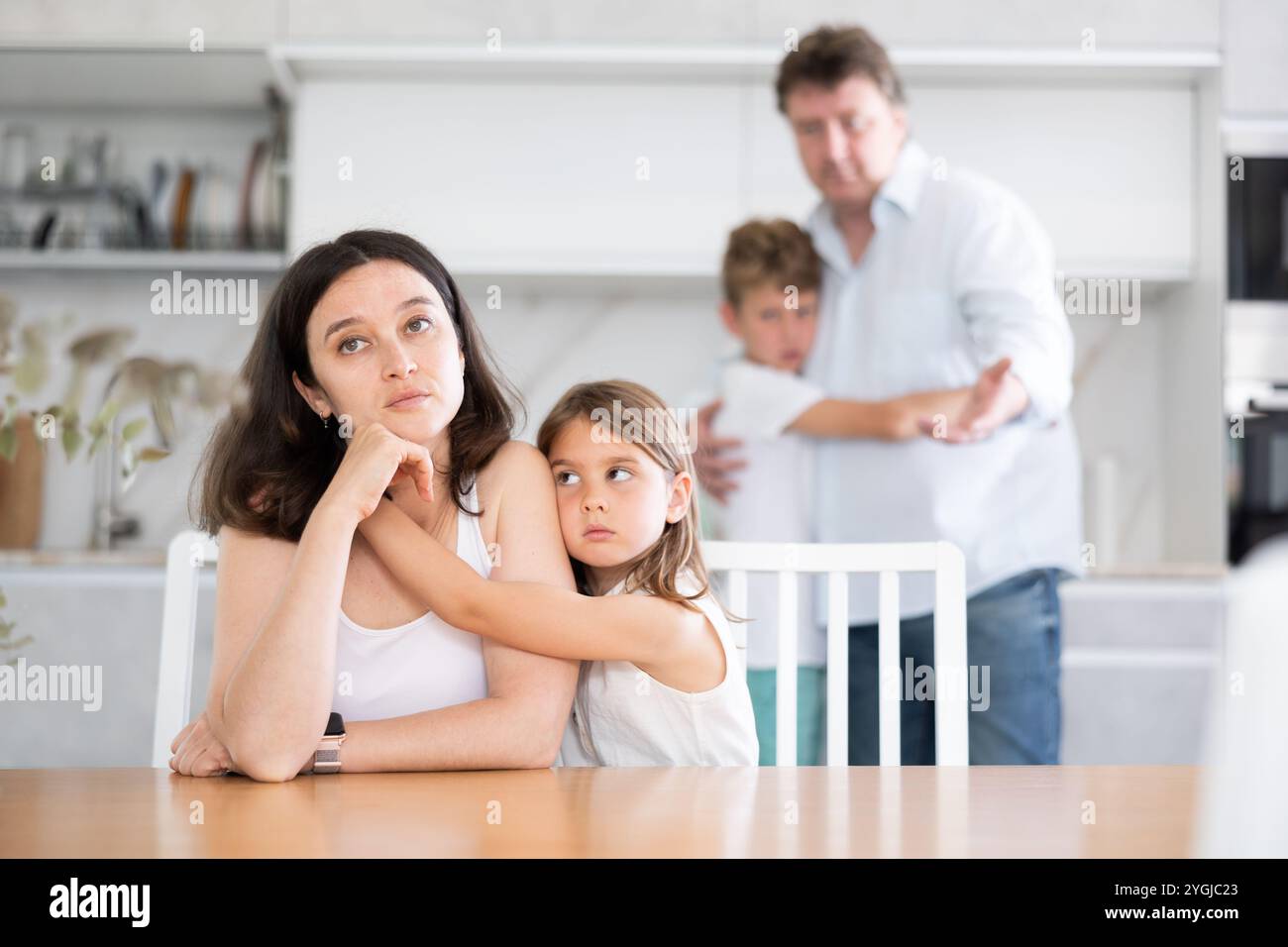 Domestic quarrel in big family - daughter hugging upset mom, son ...
