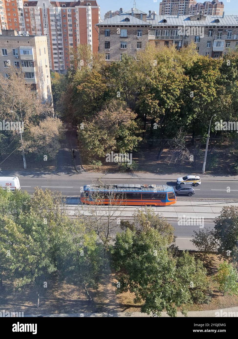 Orange tram on ul. Rogozhsky Val, on the recently renewed & reopened line 37 in Moscow, Russia, seen from above - Smartphone Captured Stock Image