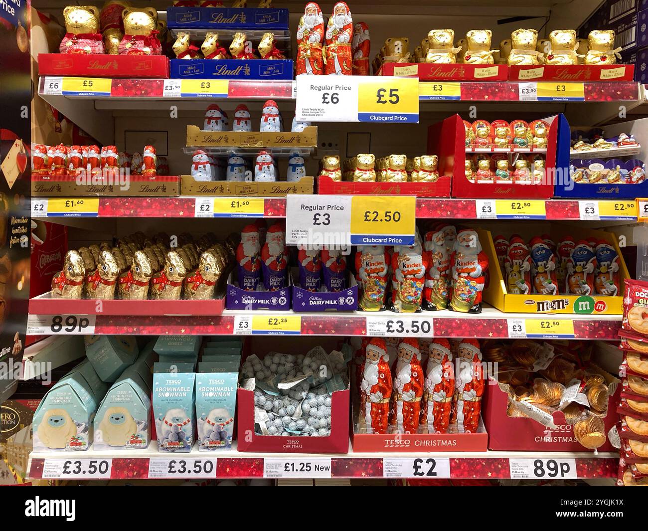 Assorted foil wrapped Christmas chocolate treats including chocolate Santas and chocolate Snowmen displayed at Supermarket - Smartphone Captured Stock Image