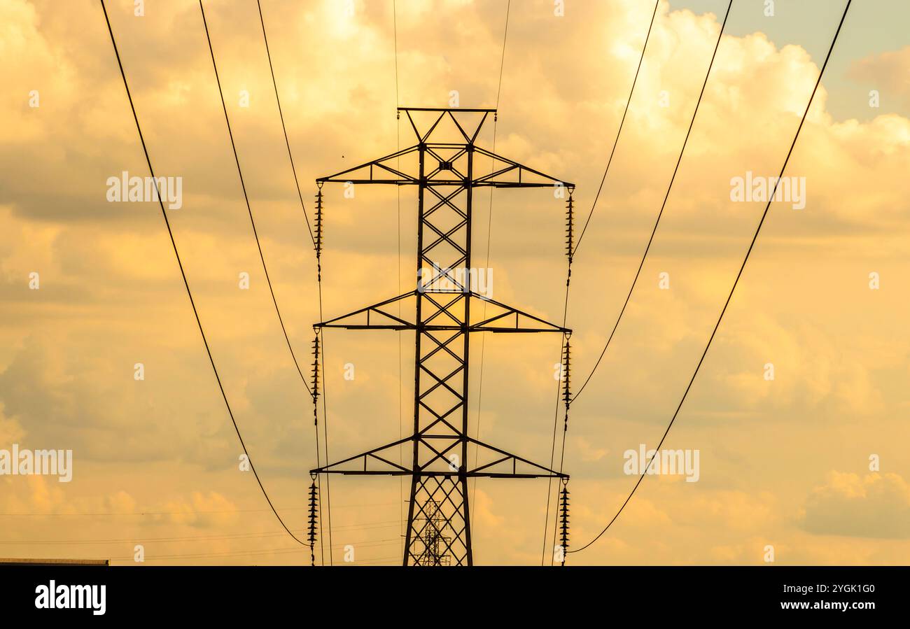 High voltage towers against sunset sky background in Brazil Stock Photo ...