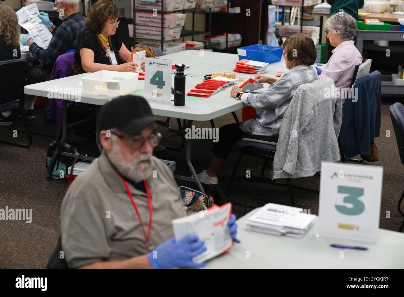 Election workers sort ballots from the 2024 election at the Clackamas ...
