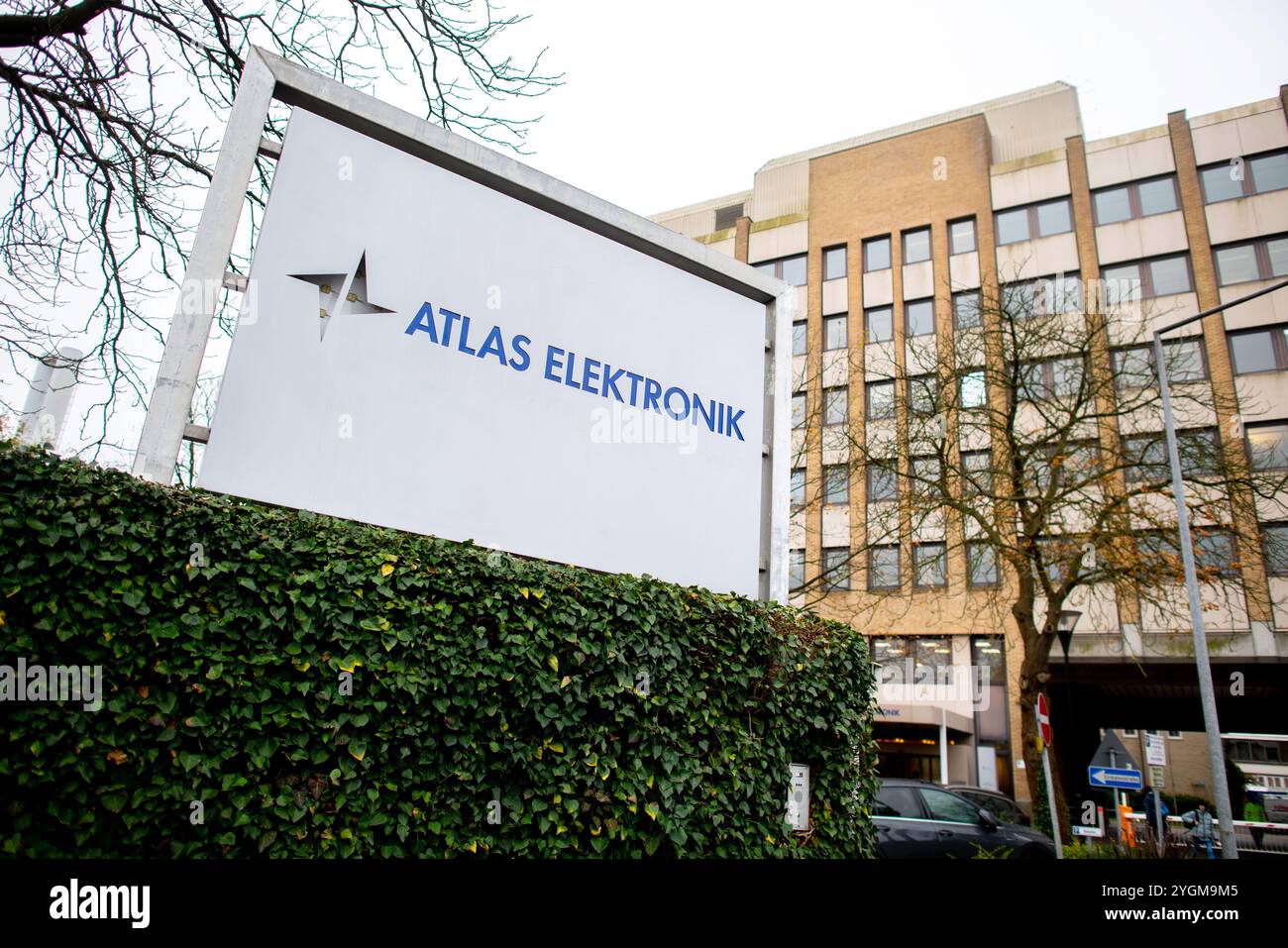 Bremen, Germany. 07th Nov, 2024. A sign with an Atlas Elektronik logo stands in front of an access road to the factory premises in the Sebaldsbrück district. The company is a supplier in the development and manufacture of integrated sonar systems for submarines, minehunting boats and combat ships as well as torpedoes. Credit: Hauke-Christian Dittrich/dpa/17�Թ����� Live News Stock Photo
