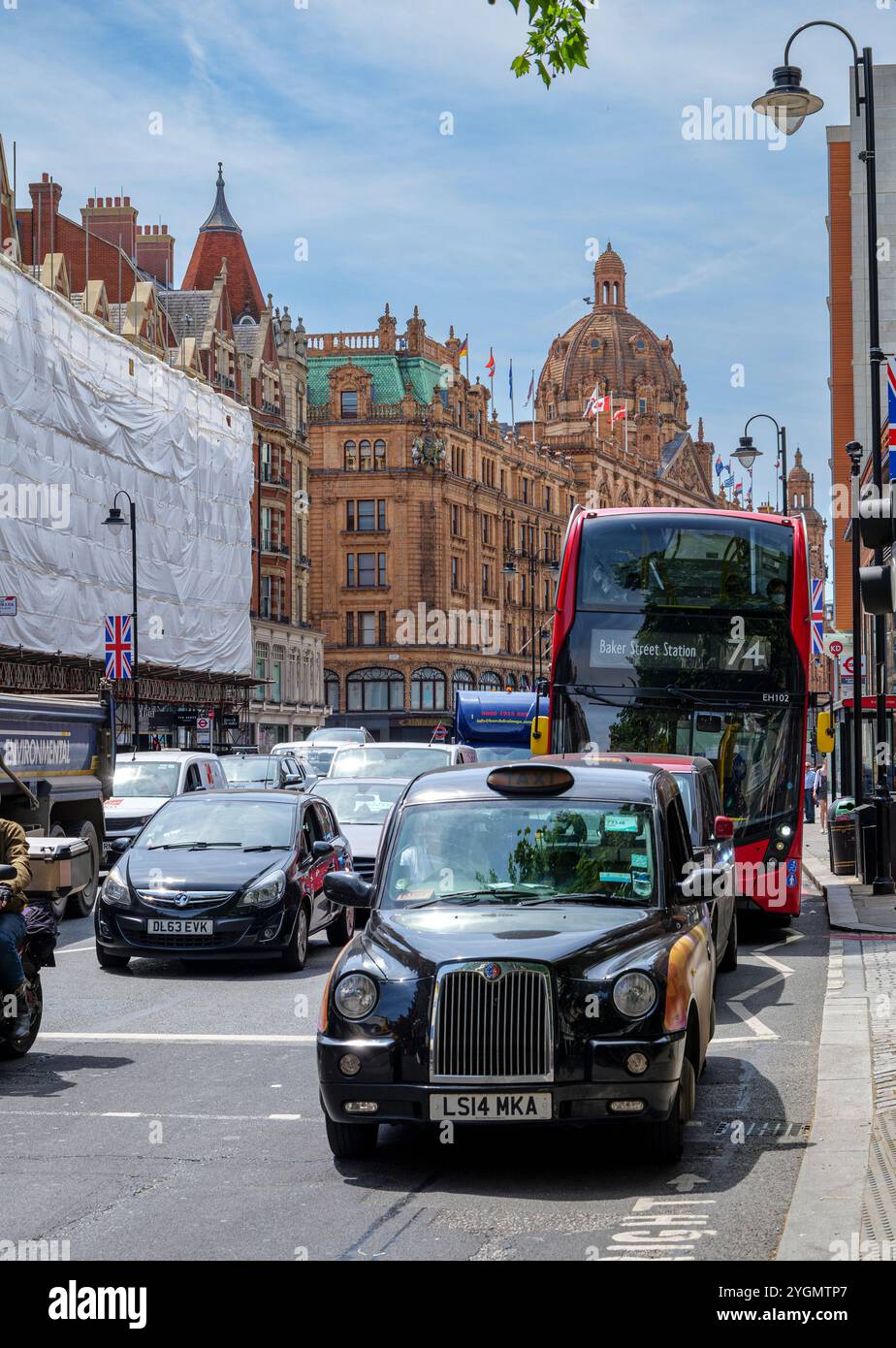 London - 06 16 2022: View of Brompton Rd with Harrods department store ...