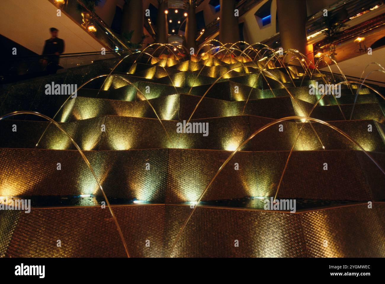 A fountain inside the Burj-al-Arab super luxury hotel, Dubai, United Arab Emirates. The water fountain is programmed to music. Stock Photo