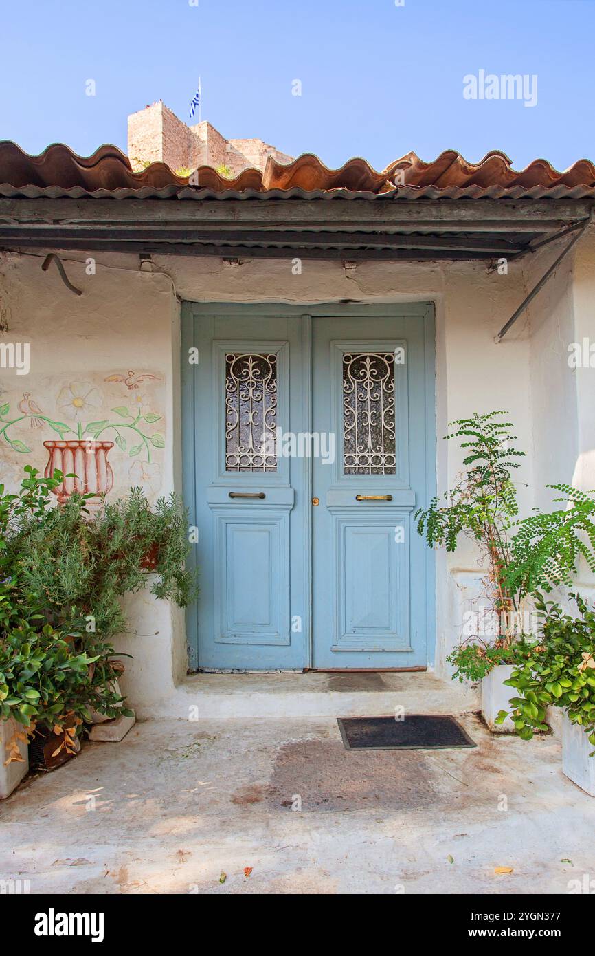 A house with old blue door in the street, Greece Stock Photo - Alamy