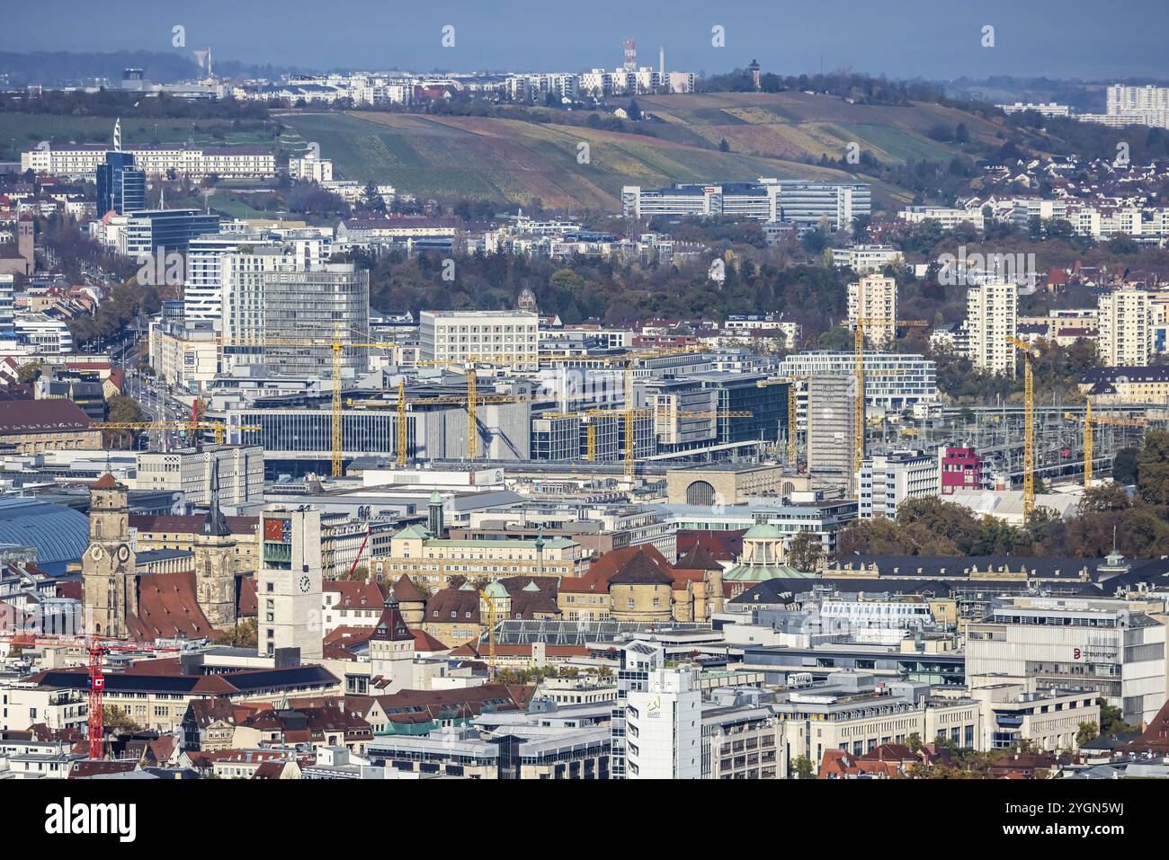 Central station with construction site Stuttgart 21, city centre with collegiate church, town hall tower, old castle and castle square. Behind it the Stock Photo