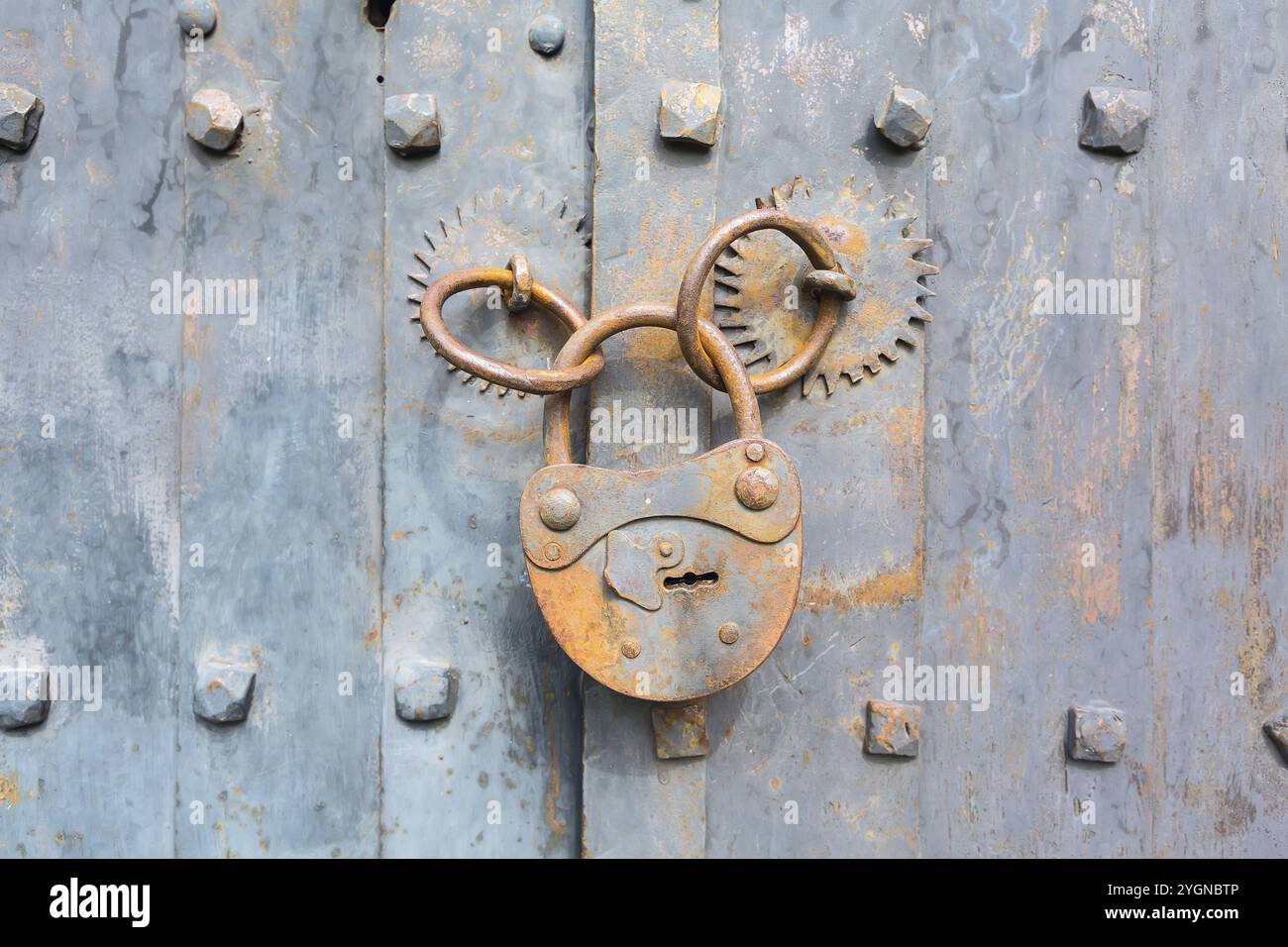 Old rusty padlock on wooden door background with copyspace Stock Photo ...