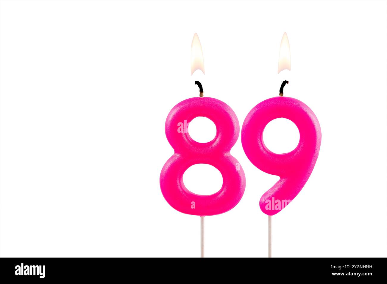 Pink number 89 birthday candle on white background Stock Photo