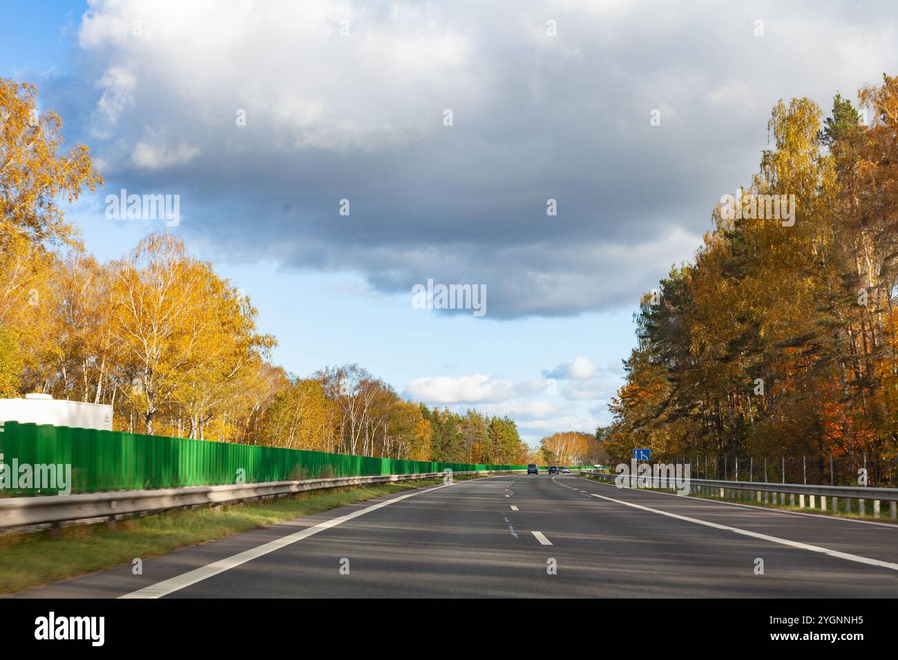 View from the car on the autumn highway A1 from Kaunas to Vilnius, Lithuania Stock Photo