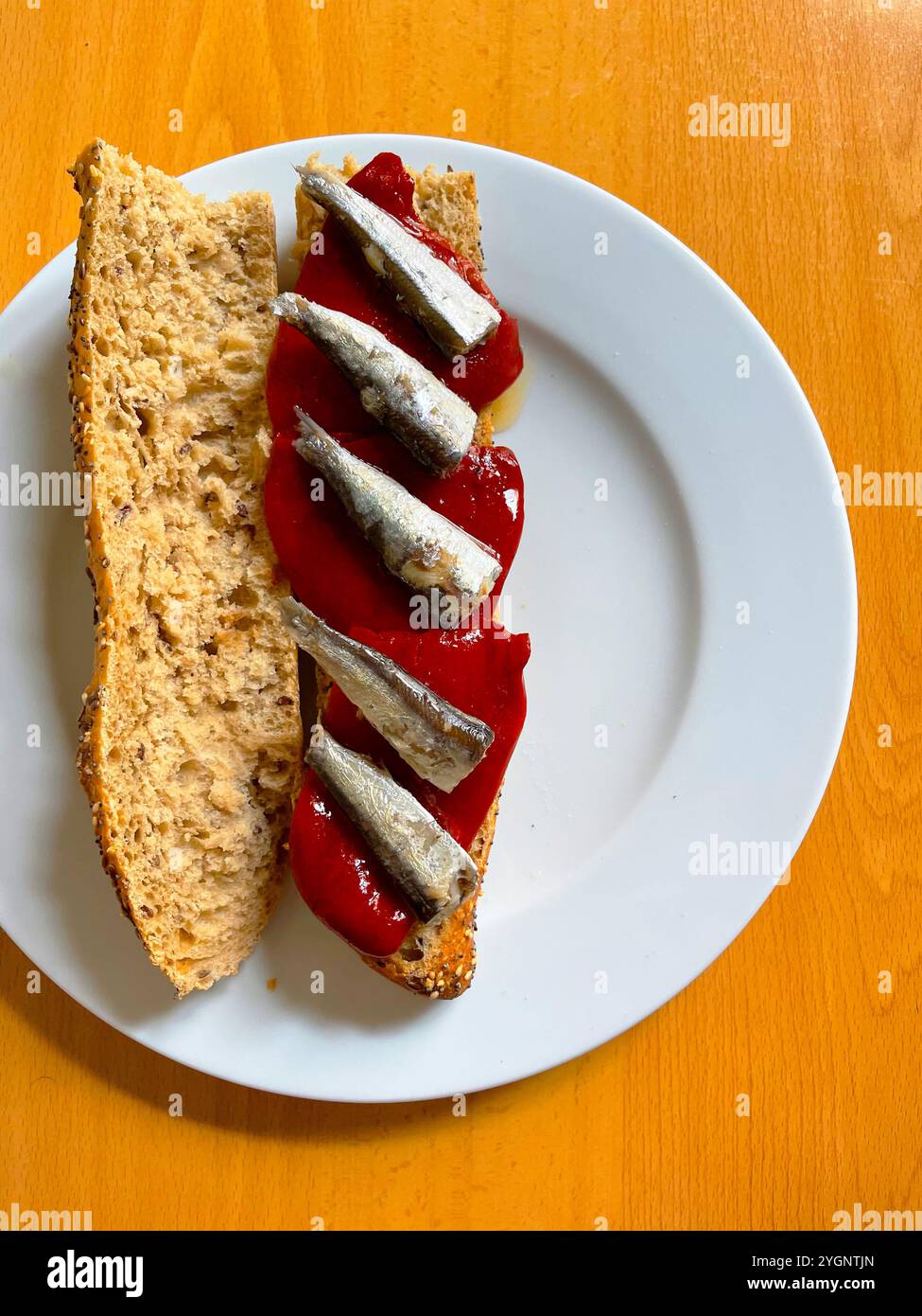 Piquillo Peppers with sardines on toast. Spain. - Smartphone Captured Stock Image