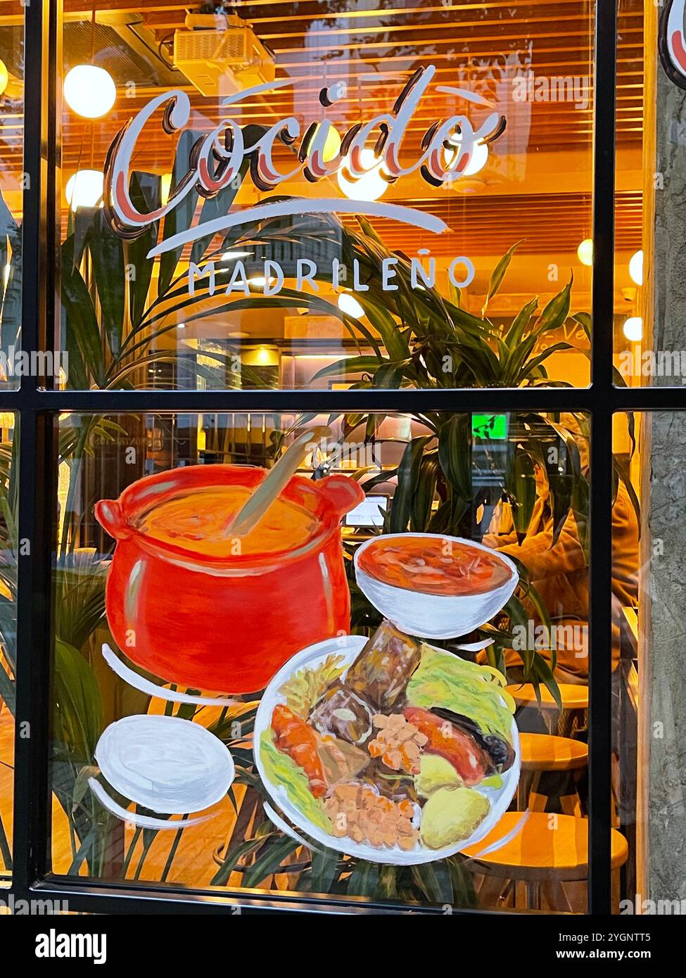 Cocido Madrileño illustration on glass of a restaurant. Madrid, Spain. Stock Photo