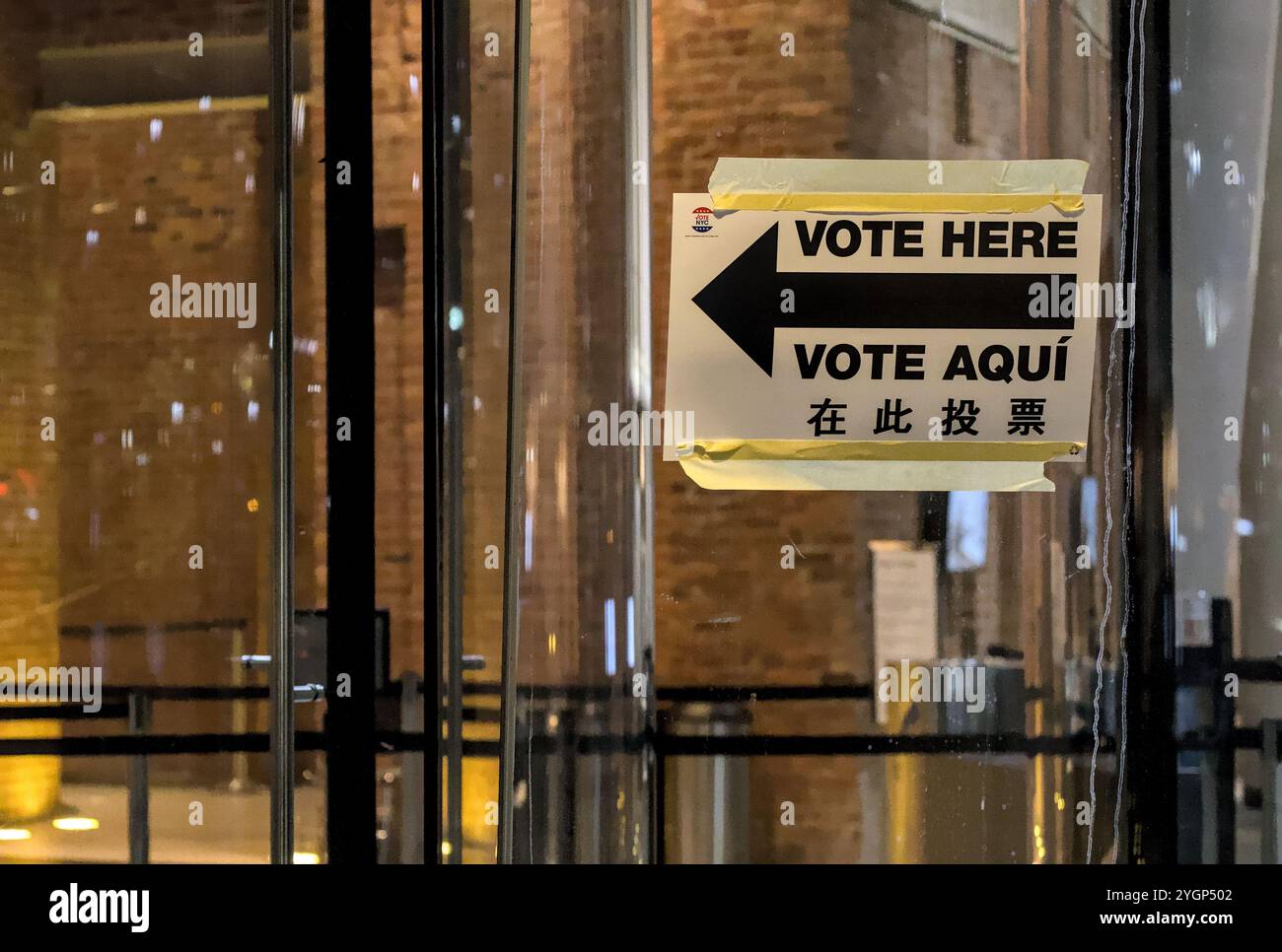 Vote Here sign with arrow on window of voting polling place, Brooklyn ...