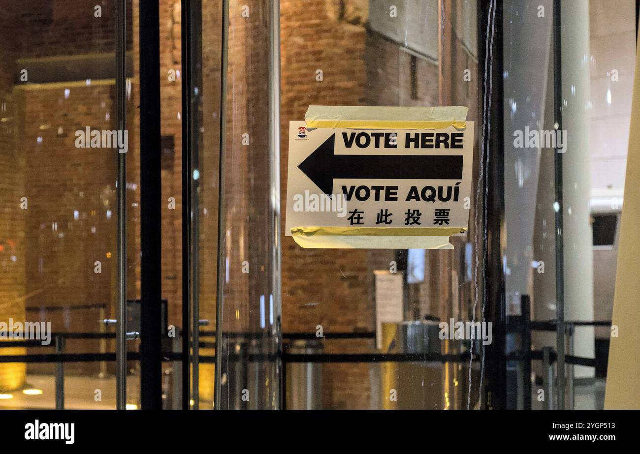 Vote Here sign with arrow on window of voting polling place, Brooklyn ...