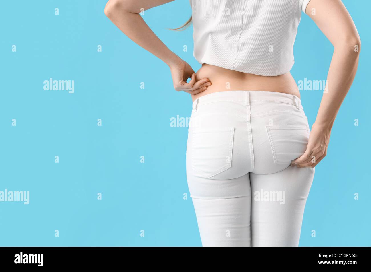 Woman wearing tight blue jeans hi-res stock photography and images - Alamy