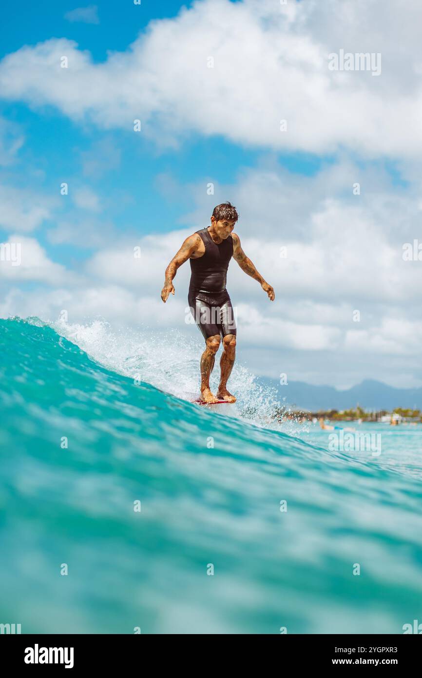 Arthur 'Toots' Anchinges showcases his skill with a nose ride at Queens ...