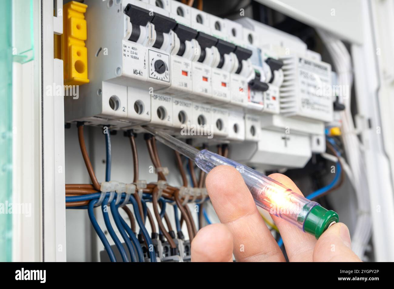 Hand Testing Electrical Circuit with Voltage Tester Stock Photo - Alamy