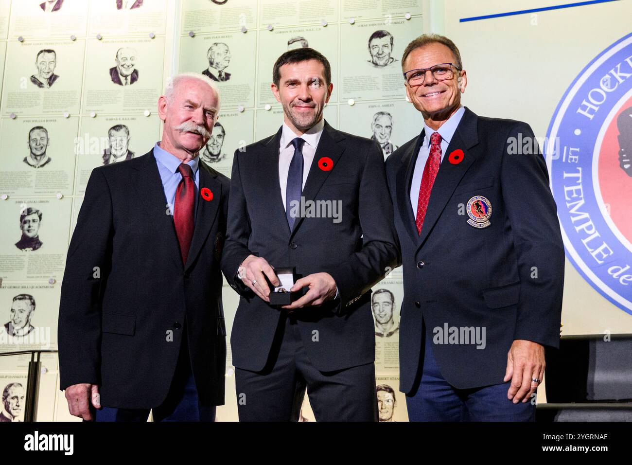 Pavel Datsyuk, center, receives his Hockey Hall of Fame ring from Lanny ...