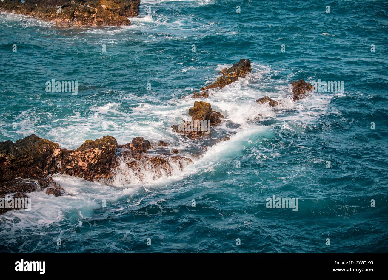Rocky sea coast. Beautiful turquoise waters of the Sea. Ocean waves ...