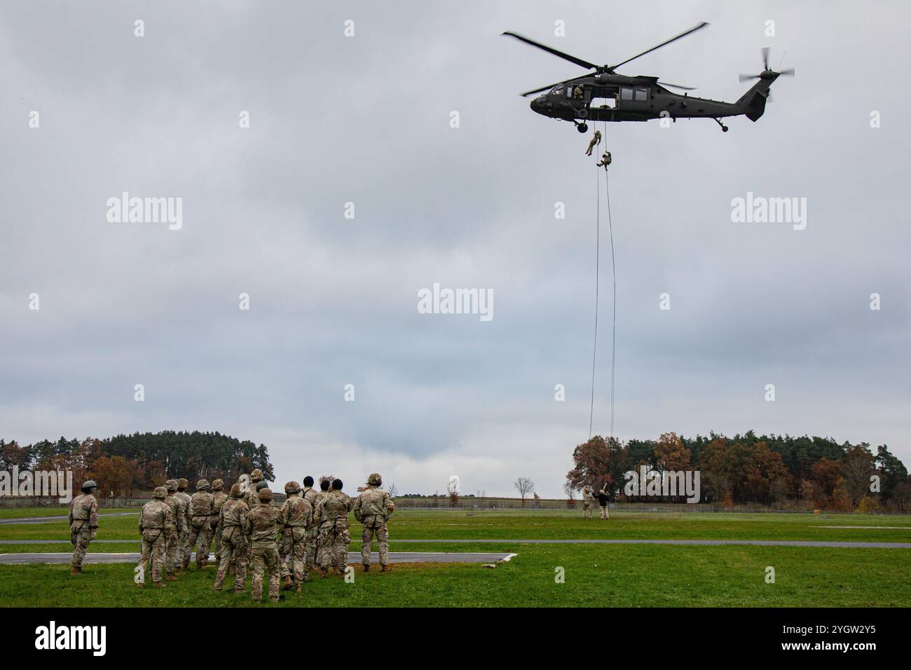 U.S. Soldiers rappel from a UH-60 Black Hawk helicopter as part of the ...