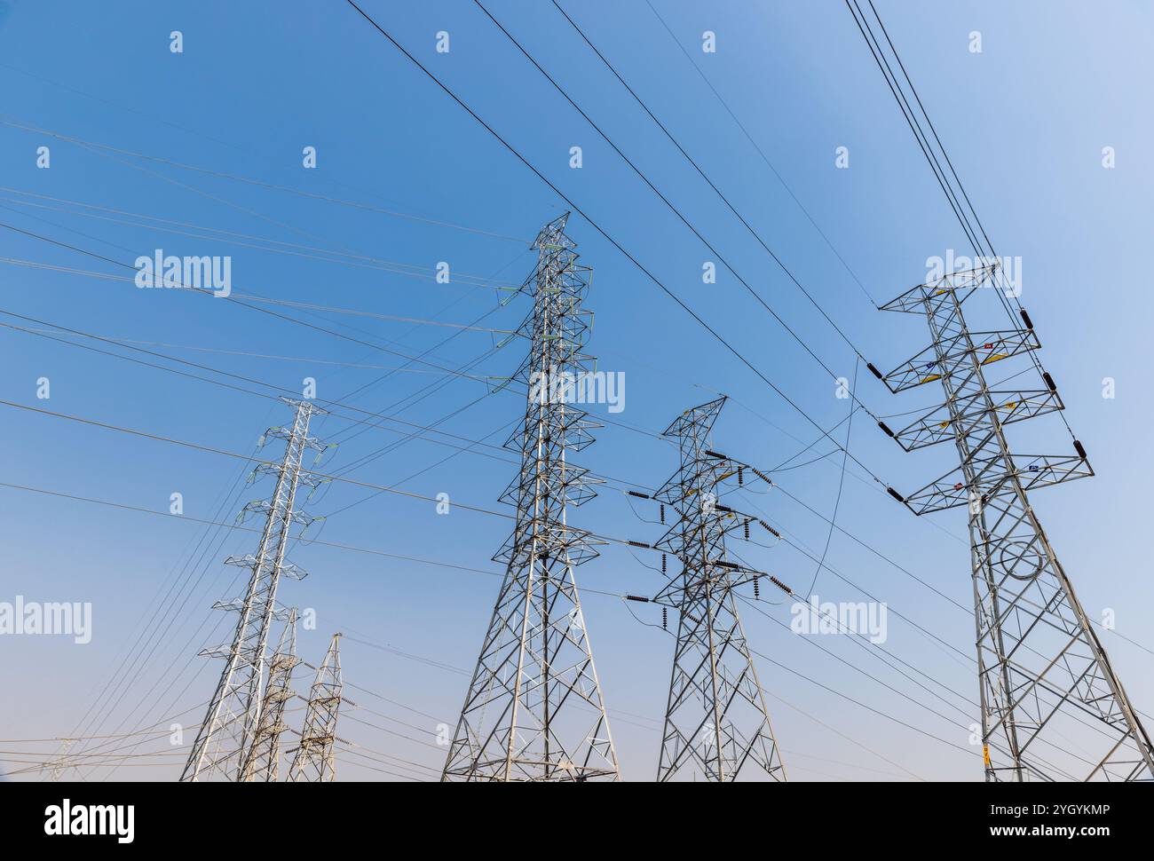 High voltage ceramic insulators on towers in Power Substation. Stock Photo