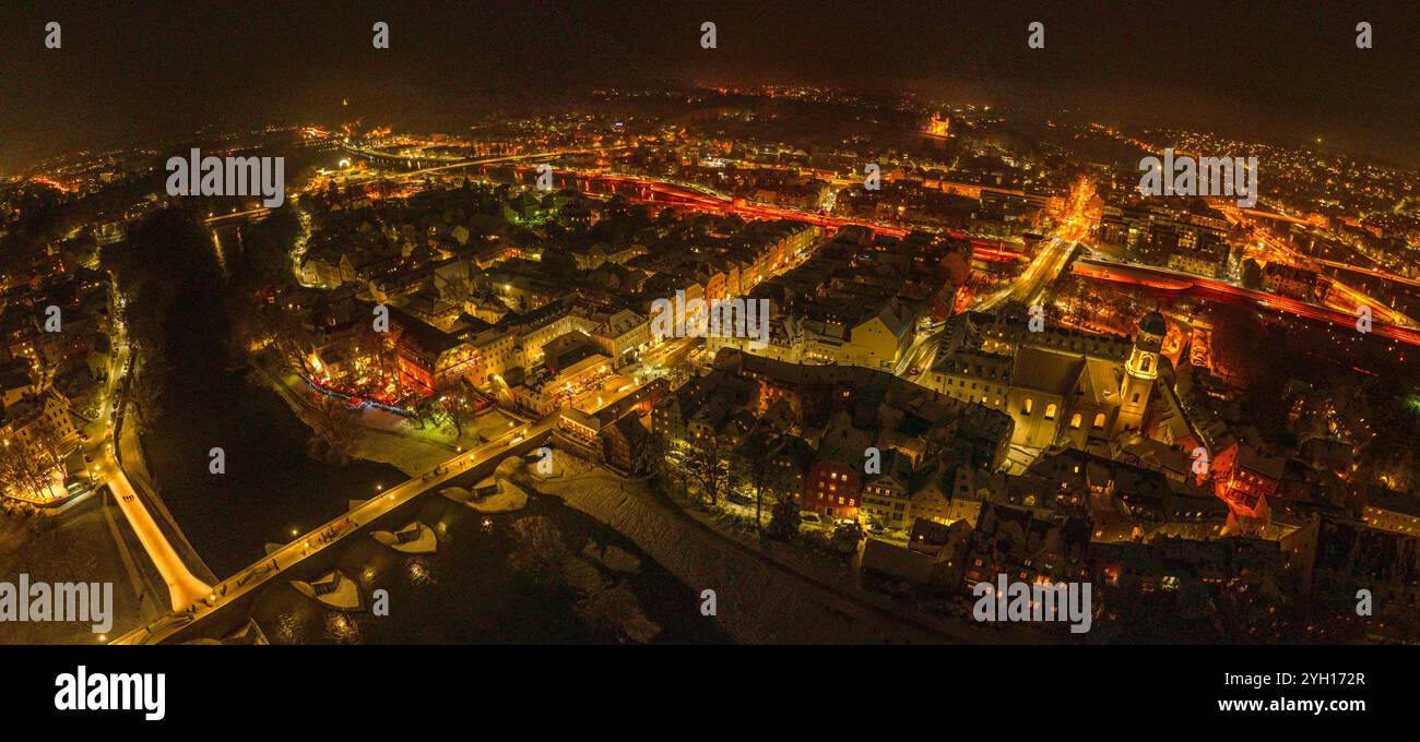 The World Heritage City of Regensburg festively illuminated at night in winter Stock Photo