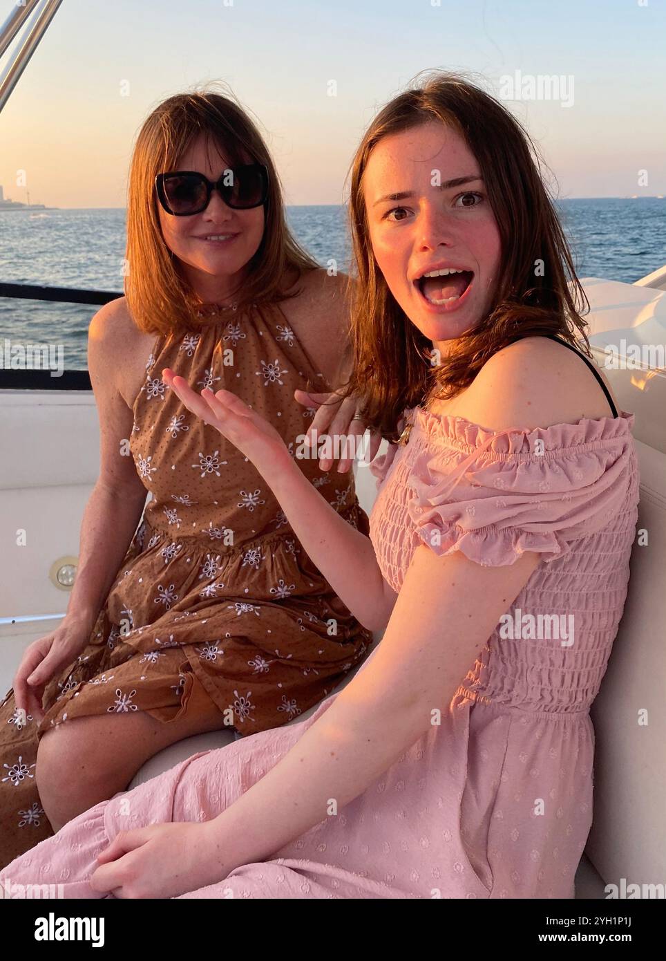 Mother and daughter on yacht dubai - Smartphone Captured Stock Image