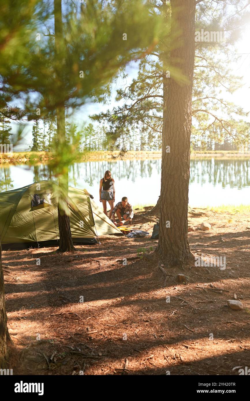 Man woman camping building tent hi-res stock photography and images - Alamy