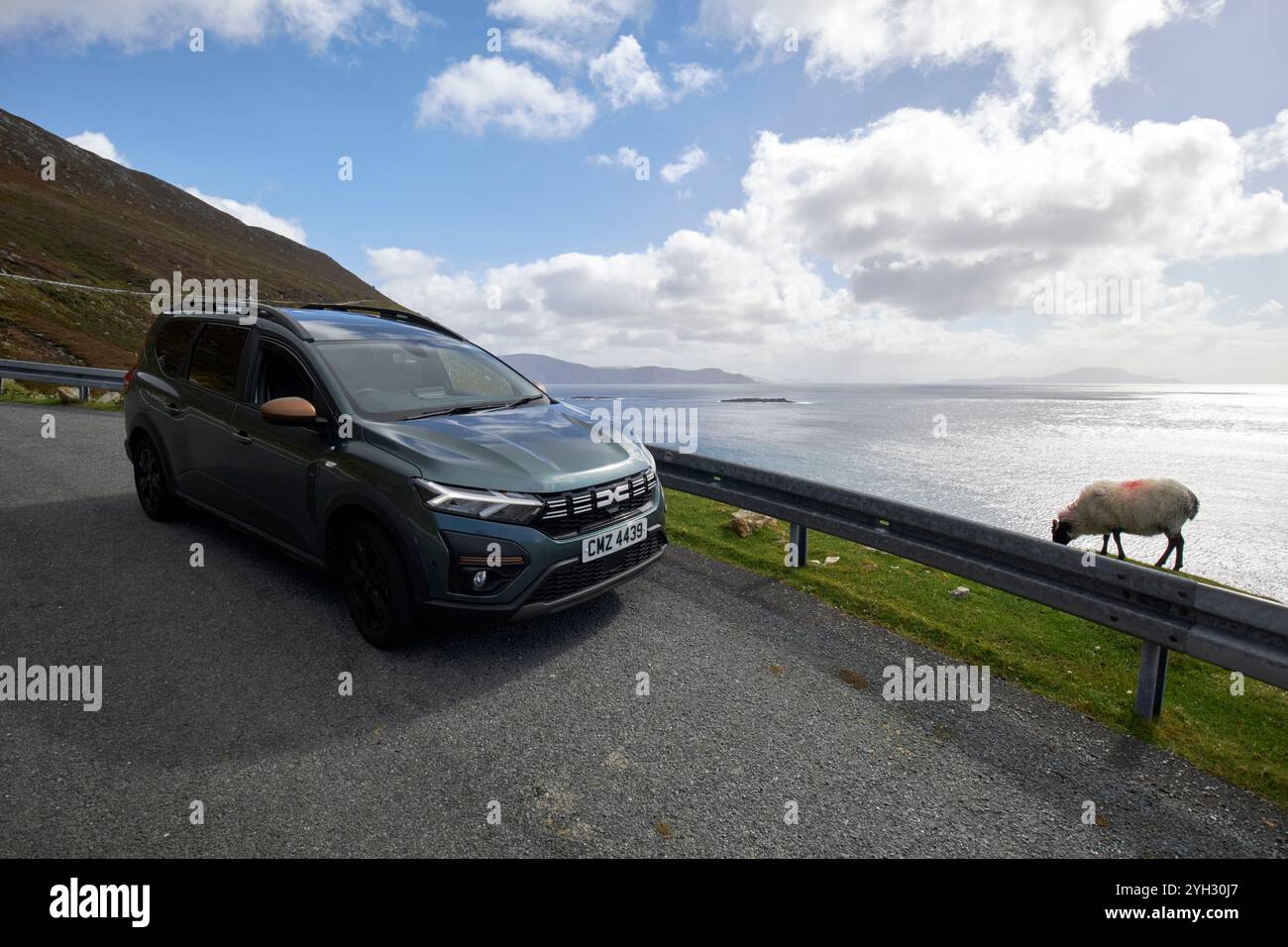 dacia jogger car mpv parked at the side of the road on the wild atlantic way keem achill island, county mayo, republic of ireland Stock Photo