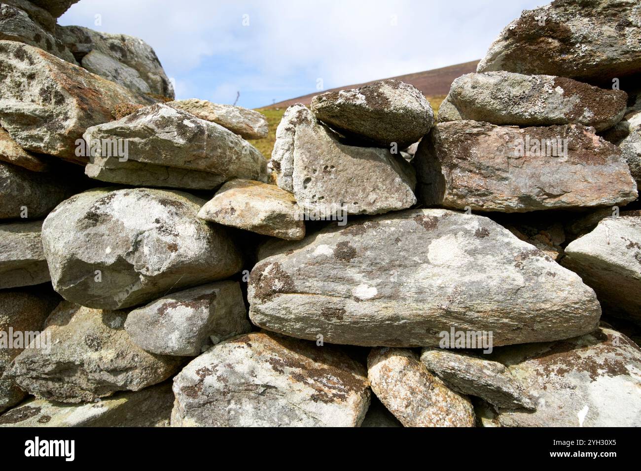 close up of stone wall construction of a ruined house in slievemore deserted village achill island, county mayo, republic of ireland Stock Photo
