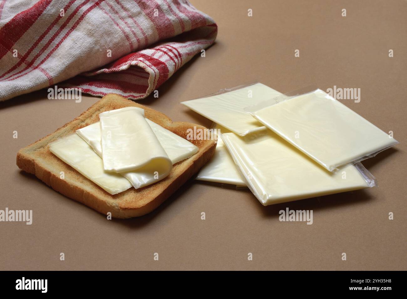 Cheese slices with toast, processed cheese in packaging Stock Photo - Alamy
